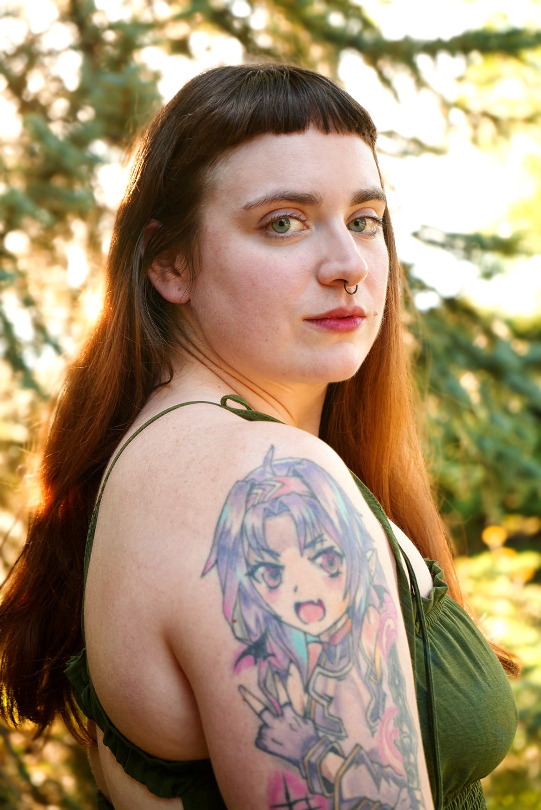 Outdoor portrait with a floral shoulder tattoo and autumn foliage