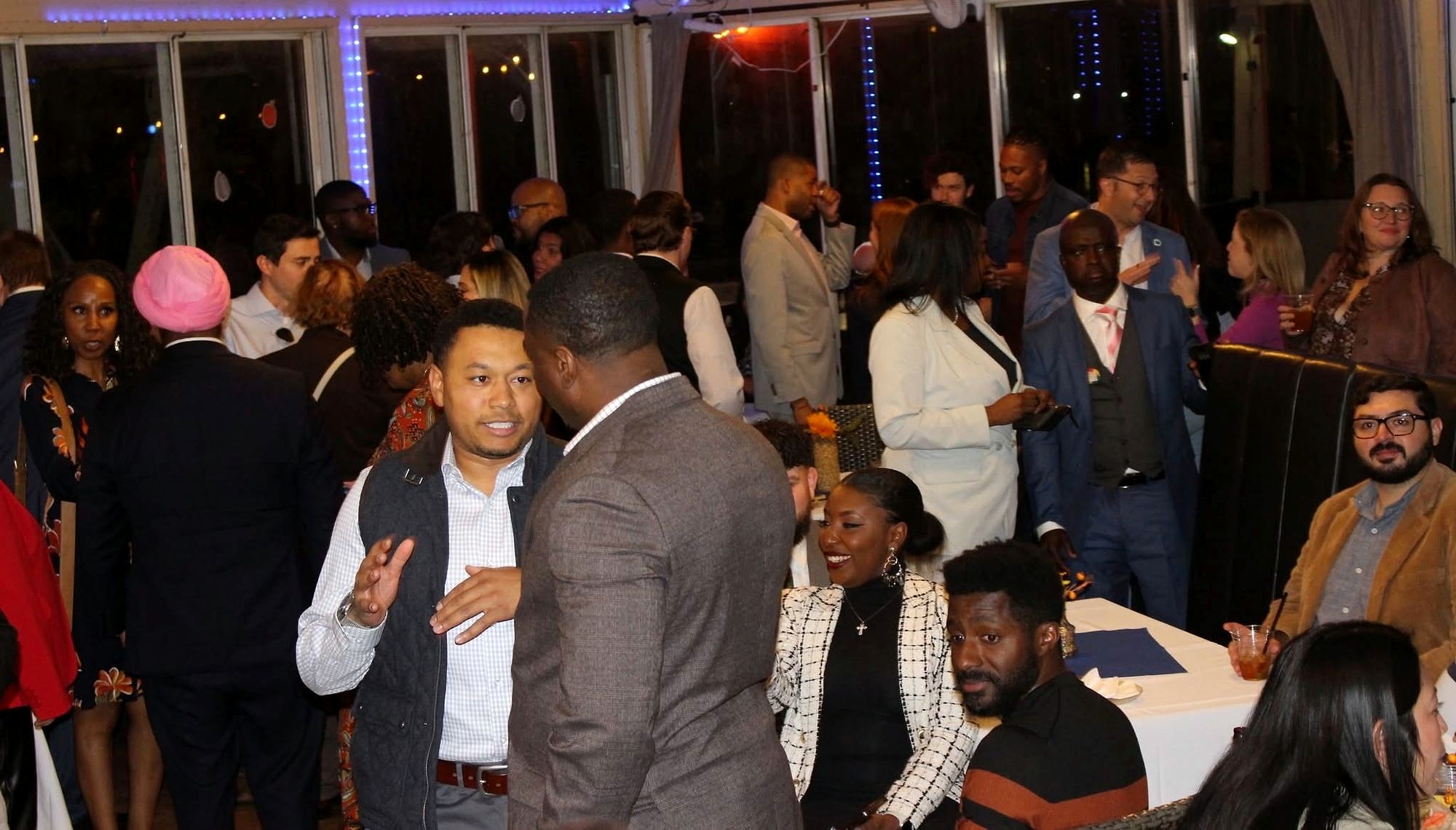 Guests dancing together at an evening celebration